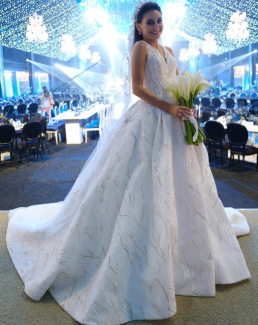 Gorgeous Bride in stunning, white wedding dress with shining lining