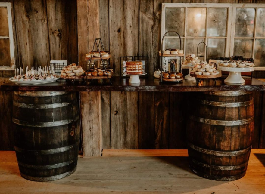 Dessert table made out of old barrels and old piece of wood