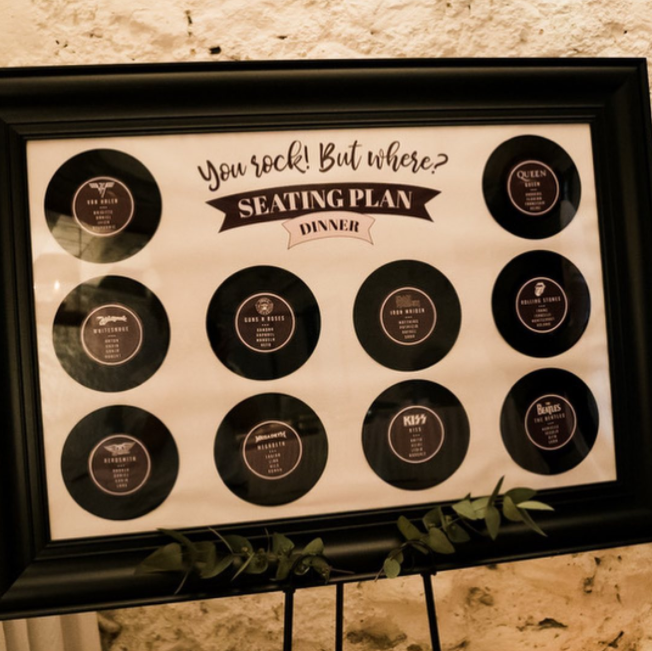 Table seating plan with vinyl discs and band names