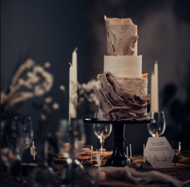 Dark table decor, 3 levels wedding cake with gray draped decoration